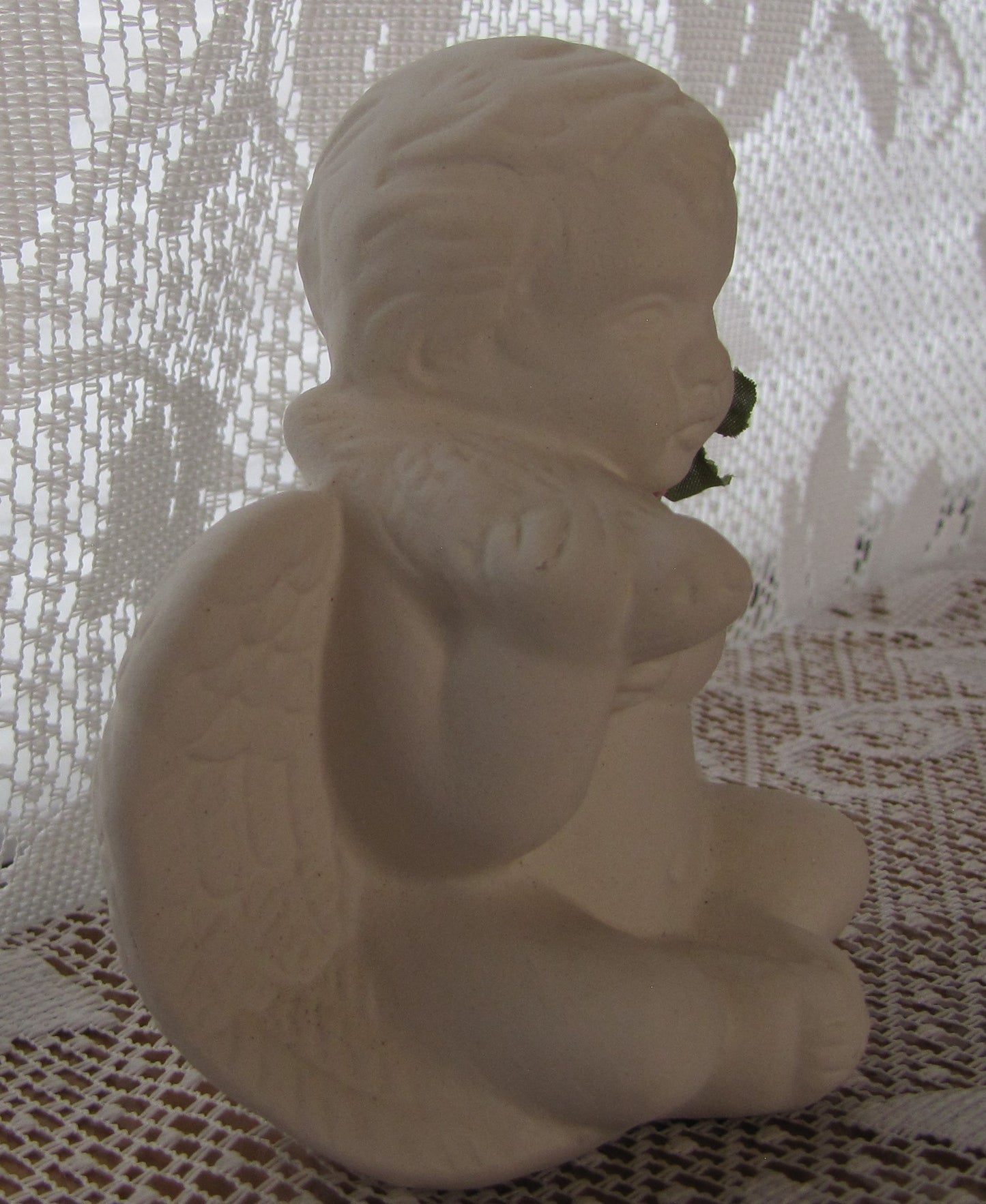 Angel; Ceramic Sitting Cherub Holding Bird on Shoulder (with Matte Finish) 4"T x 4"W, Used , Excellent Condition