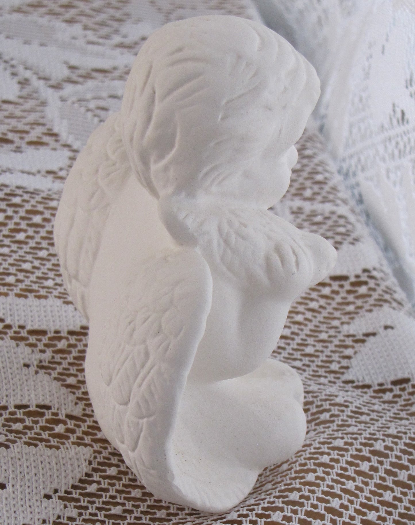 Angel; Ceramic Sitting Cherub Holding Bird on Shoulder (with Matte Finish) 4"T x 4"W, Used , Excellent Condition