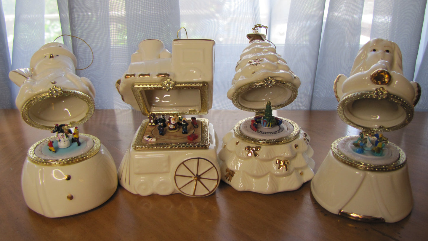 2010 Mr Christmas Gold Edition Porcelain Music Box Set of 4, Tree, Snowman, Angel, Train.  Batch 6447, white with gold trim and box.