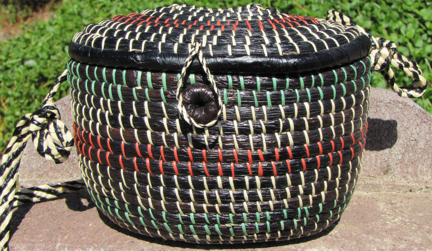 Hand weaved collection basket; closable with strap for easy carrying